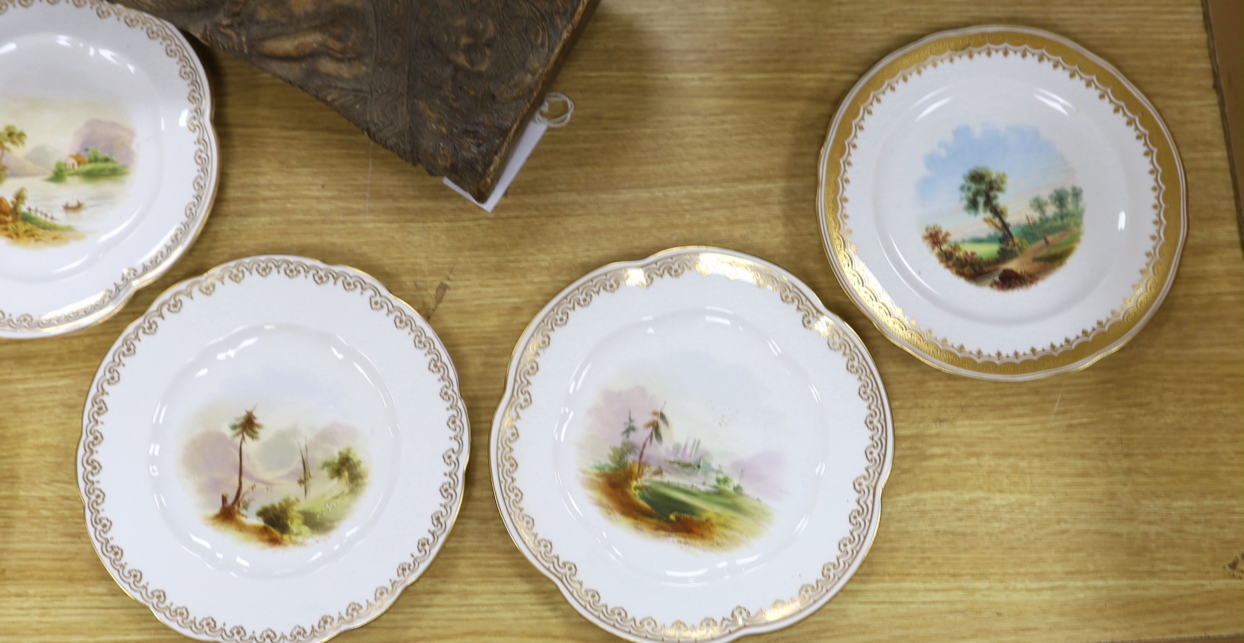 Eight mid-19th century decorative plates, painted with landscapes, probably Coalport, the largest 24cm in diameter